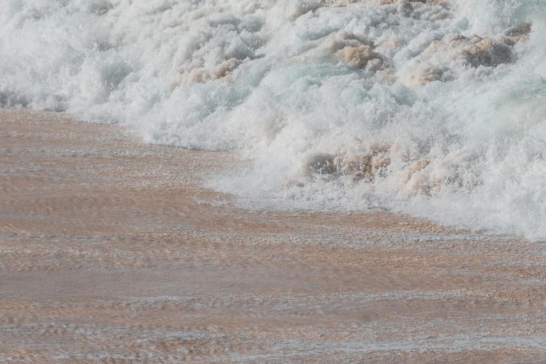 close up of waves crashing on the shore