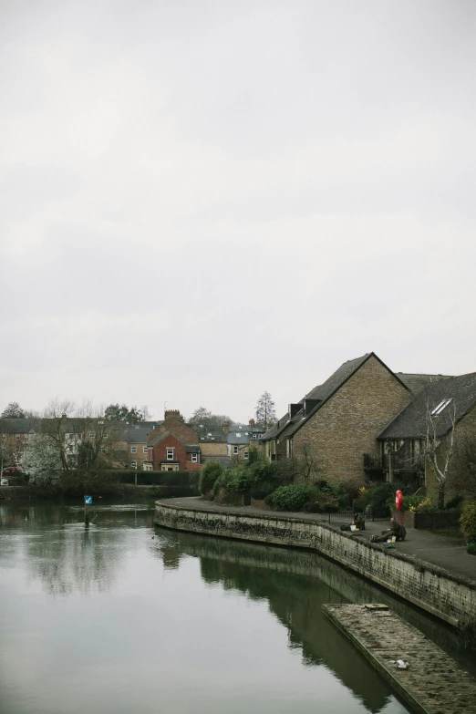 a river in an area surrounded by several buildings