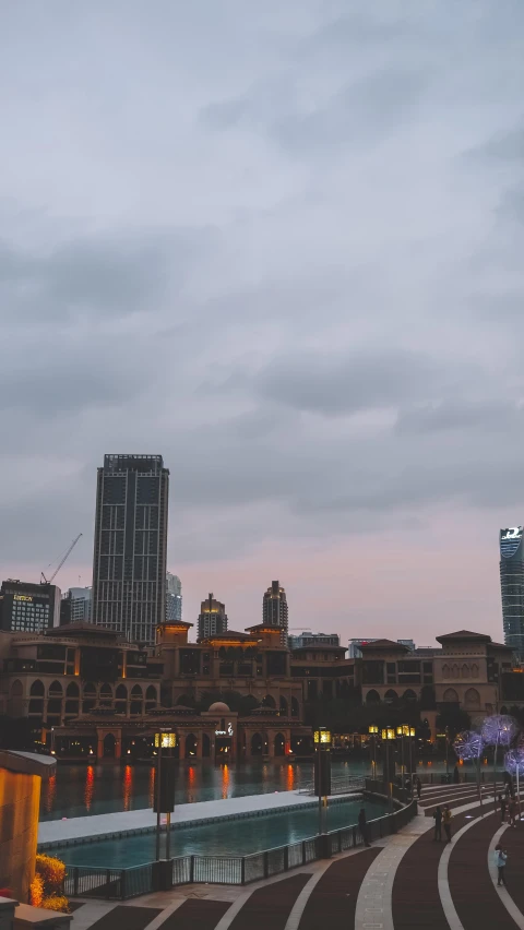 a scenic view of a large cityscape at dusk