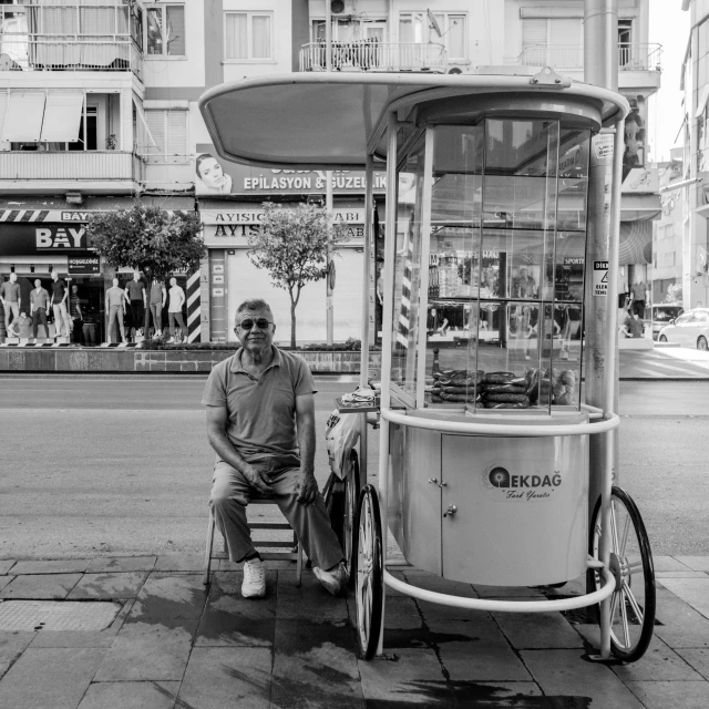 a man standing next to a bicycle on a street