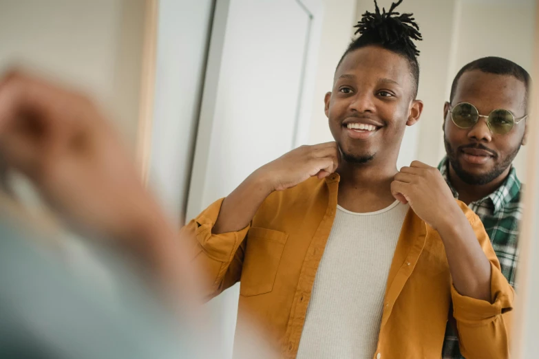 a man gets ready to go in the mirror