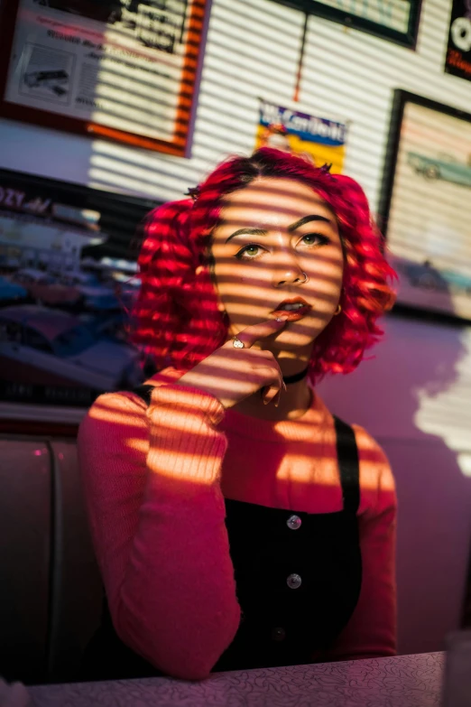 the woman is posing with red hair and sunbeams