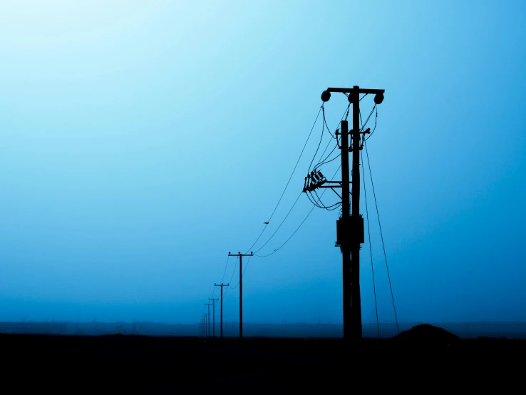 a telephone pole that is in the middle of the night