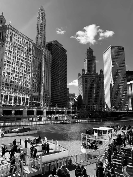 people walk in the street by the water