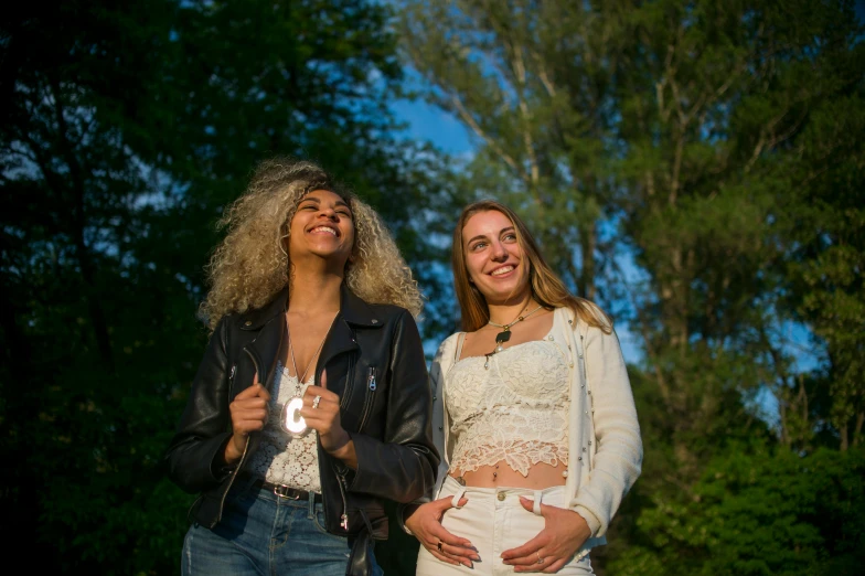 two beautiful young women smiling and laughing