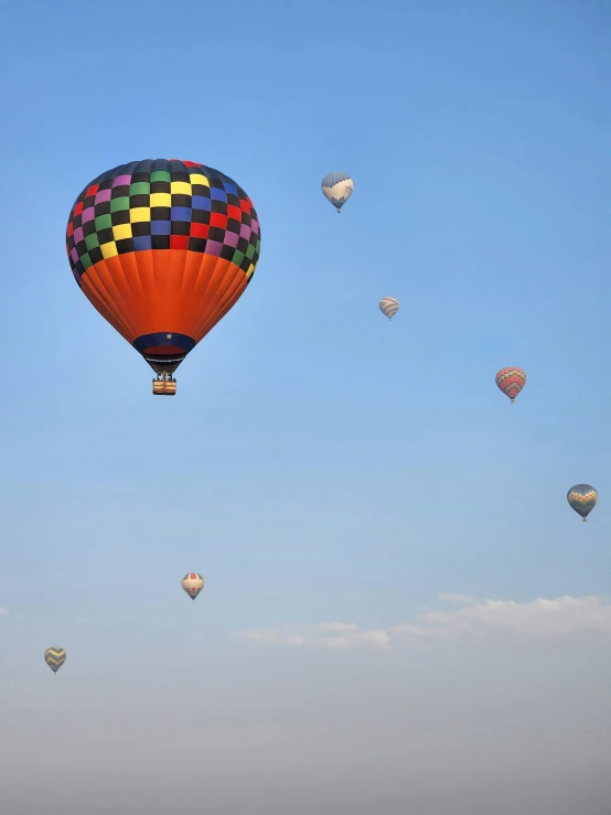 there is a number of colorful  air balloons