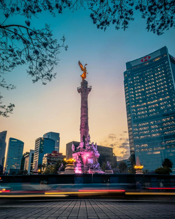 a big building that has a statue next to it