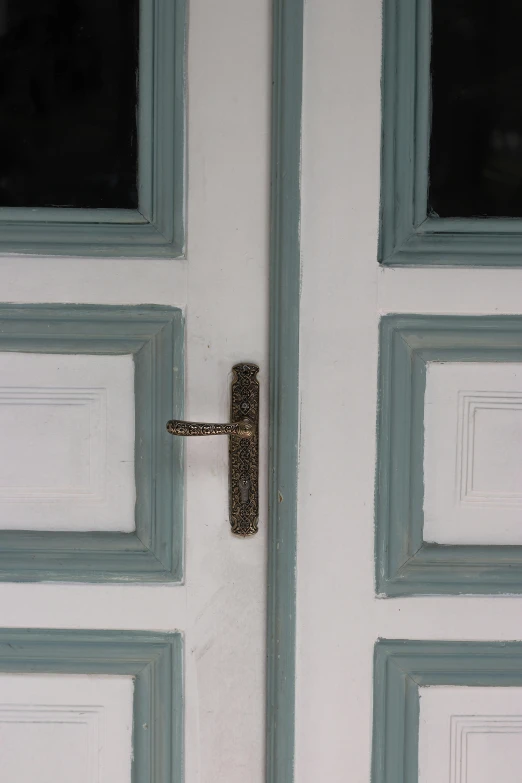 a door handle on the side of a white door