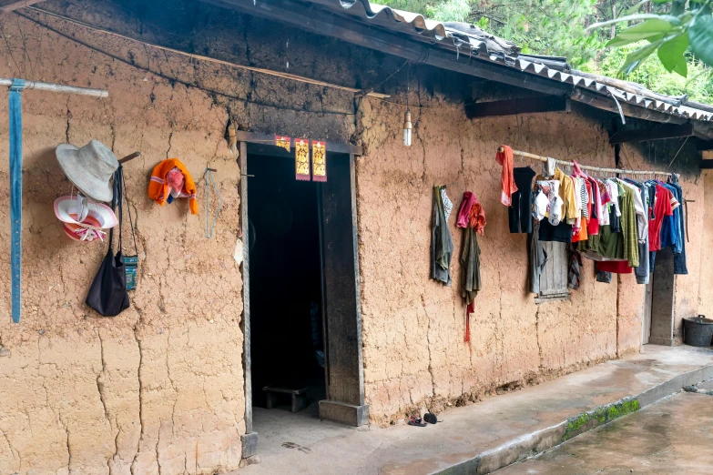 a building with clothes hanging outside on a rope