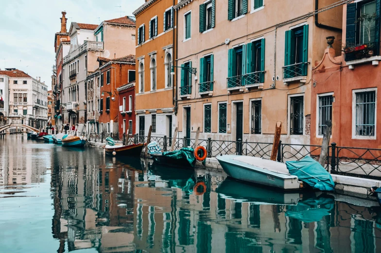 there are many boats docked at this small body of water