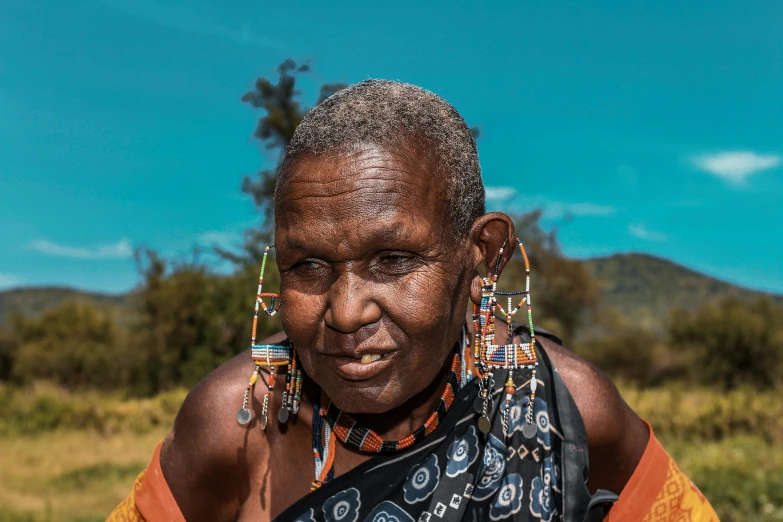 a woman with a big amount of piercings and ear rings