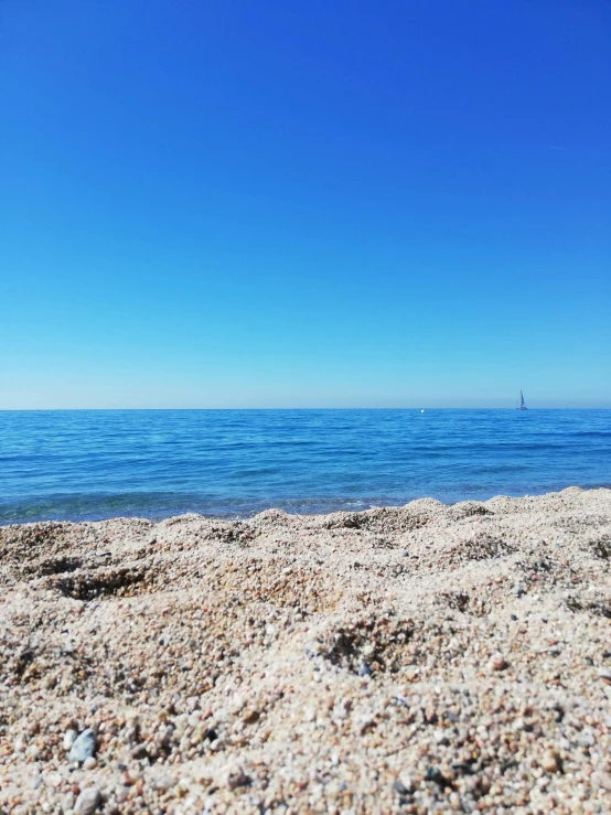 a beach with the water and sand covering it