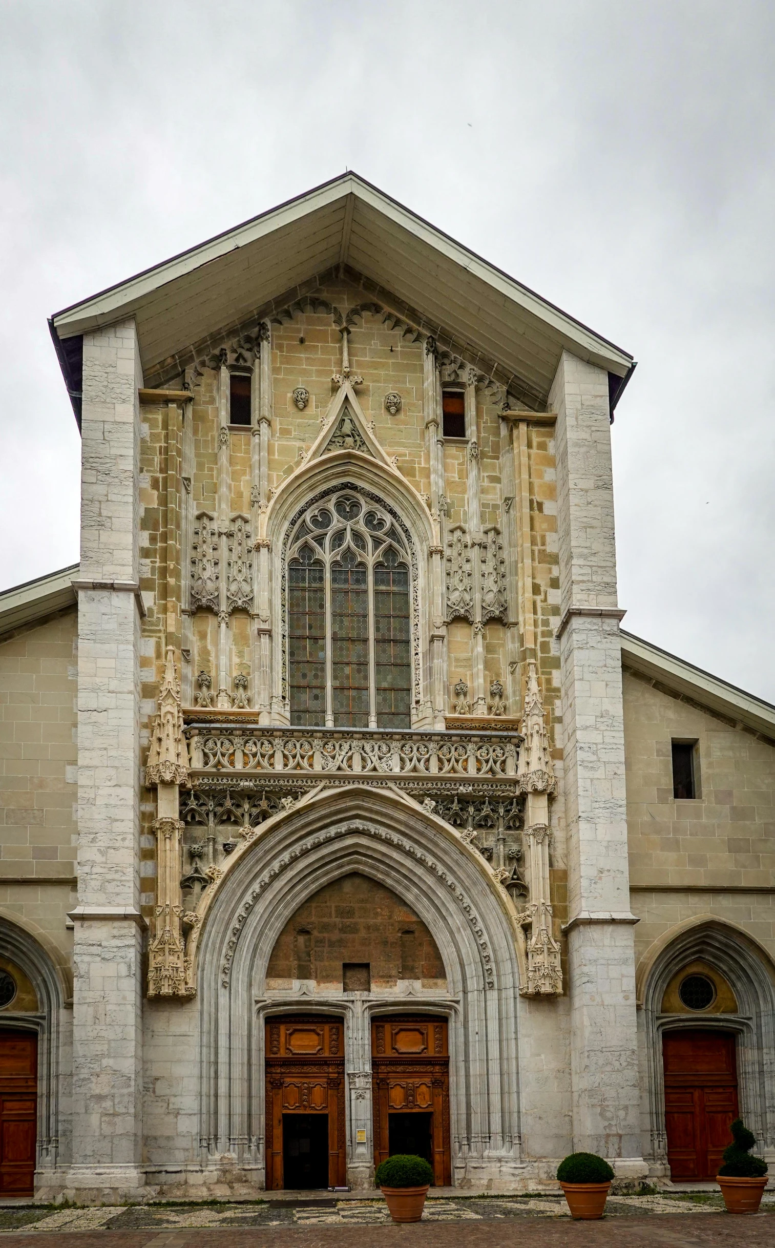 an old church building with ornate arched doors