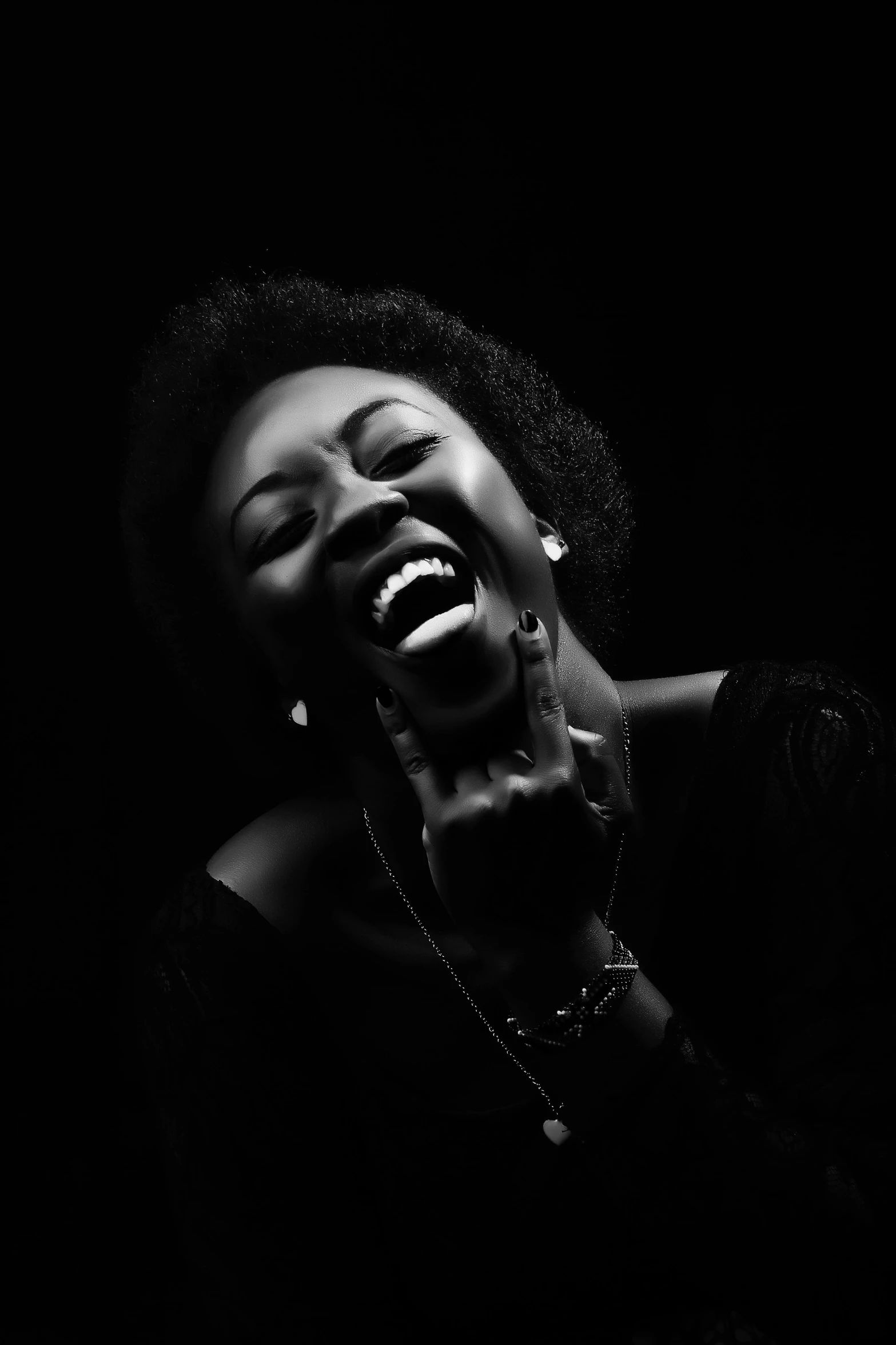 an african american woman singing into her microphone