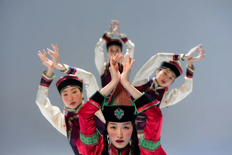 a group of young people are performing a dance