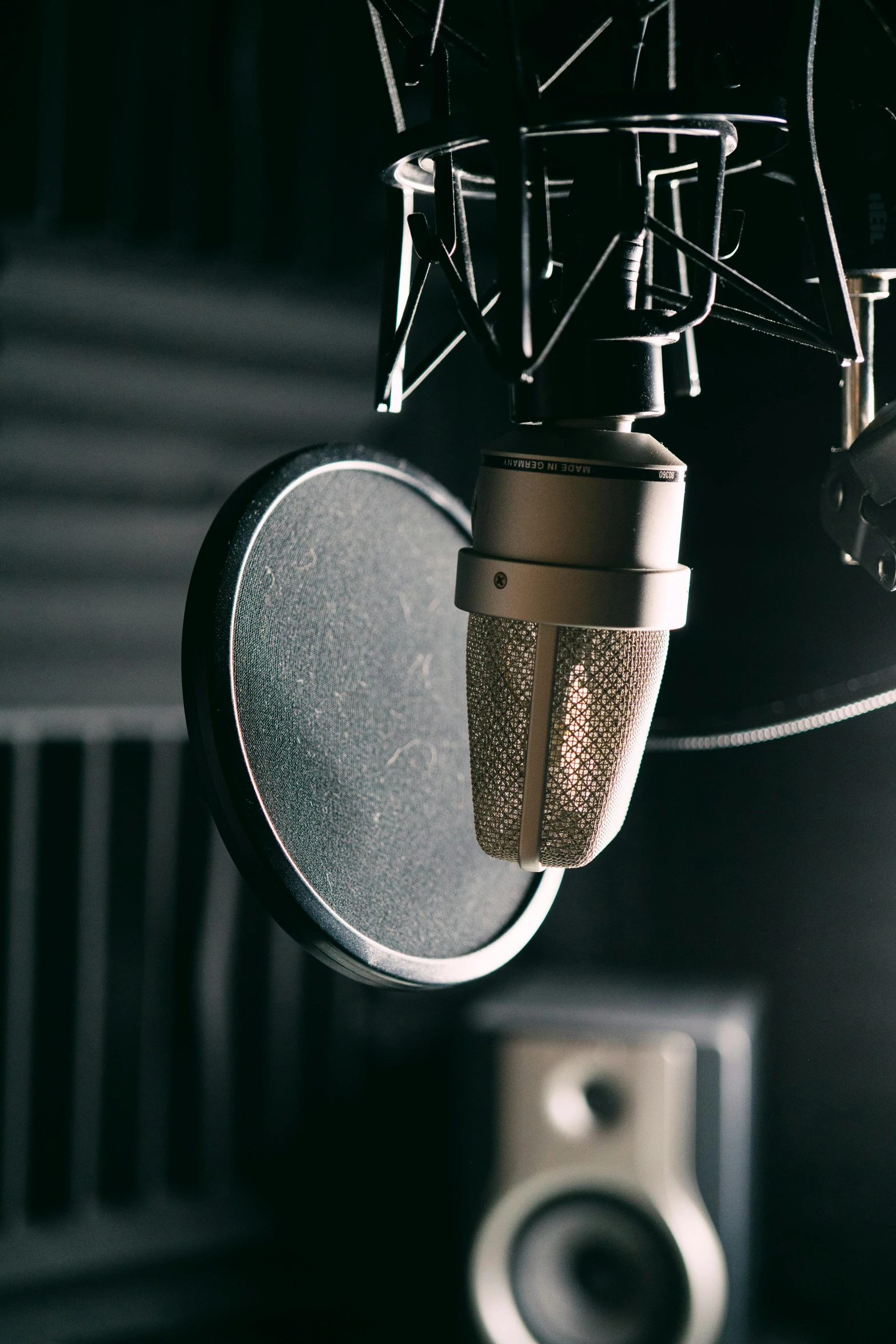 an old microphone is next to a speaker