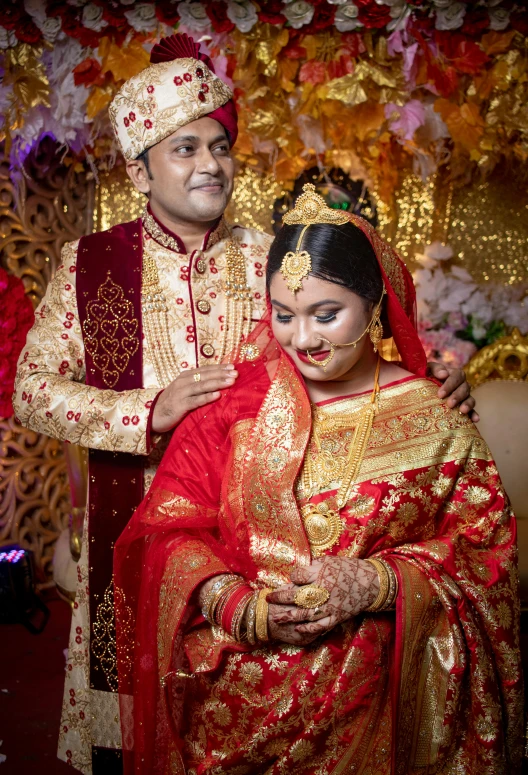 the bride and groom pose together for a portrait in their wedding attire