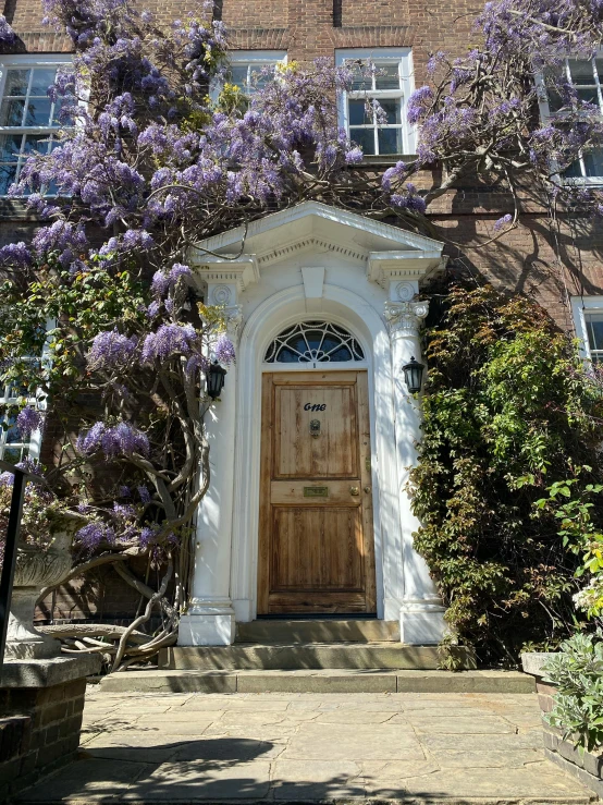 a large wooden door in the middle of a house