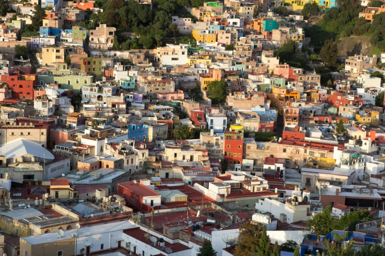 a large city is filled with colorfully colored buildings