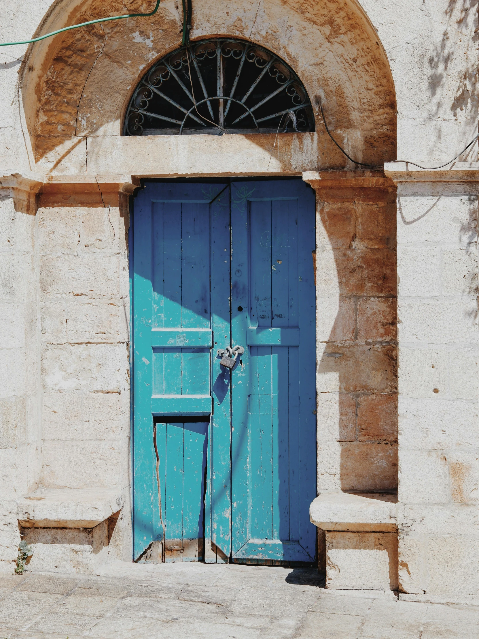 a blue and white door that is on the side of a building