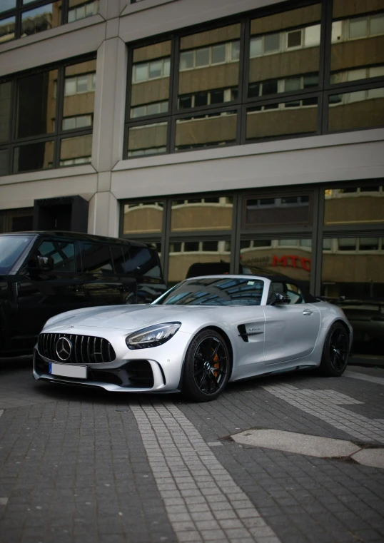 two cars parked in front of a building