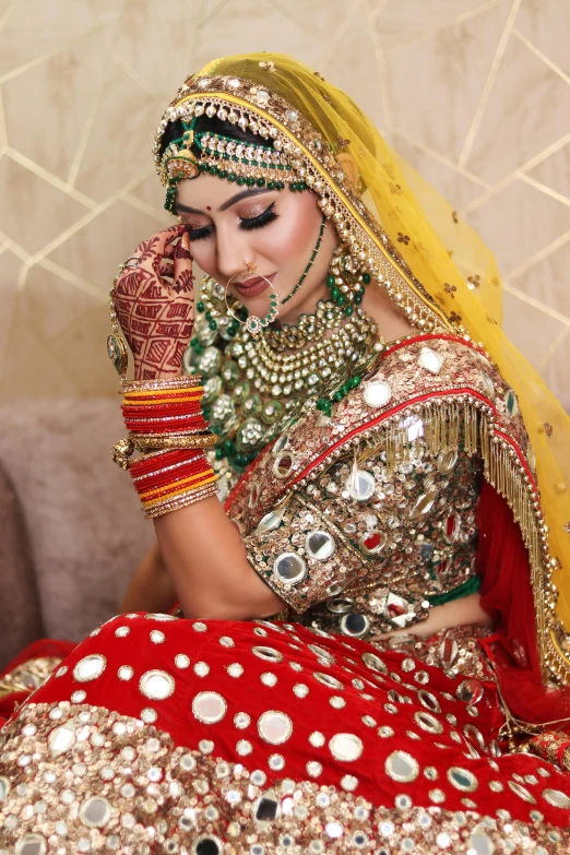 a woman sitting in her bridal suite looking to her right