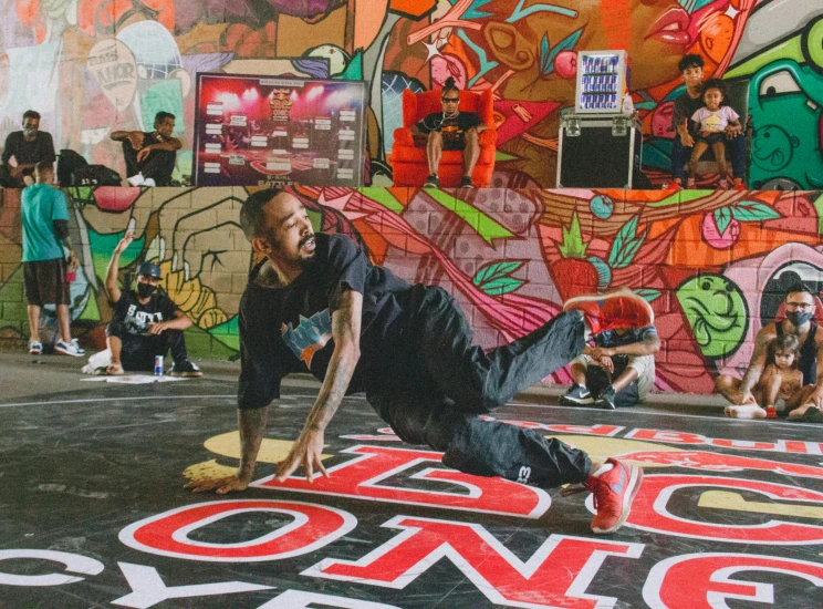 a man is performing a skateboarding stunt on a ramp