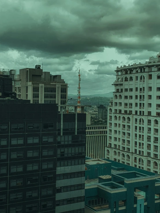 a large building with a clock tower under a cloudy sky