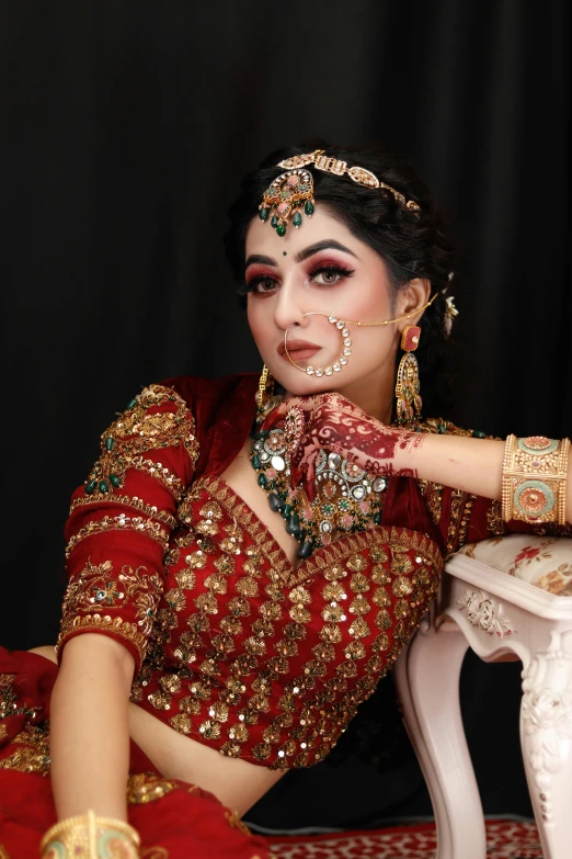 a woman is wearing an ornate red outfit