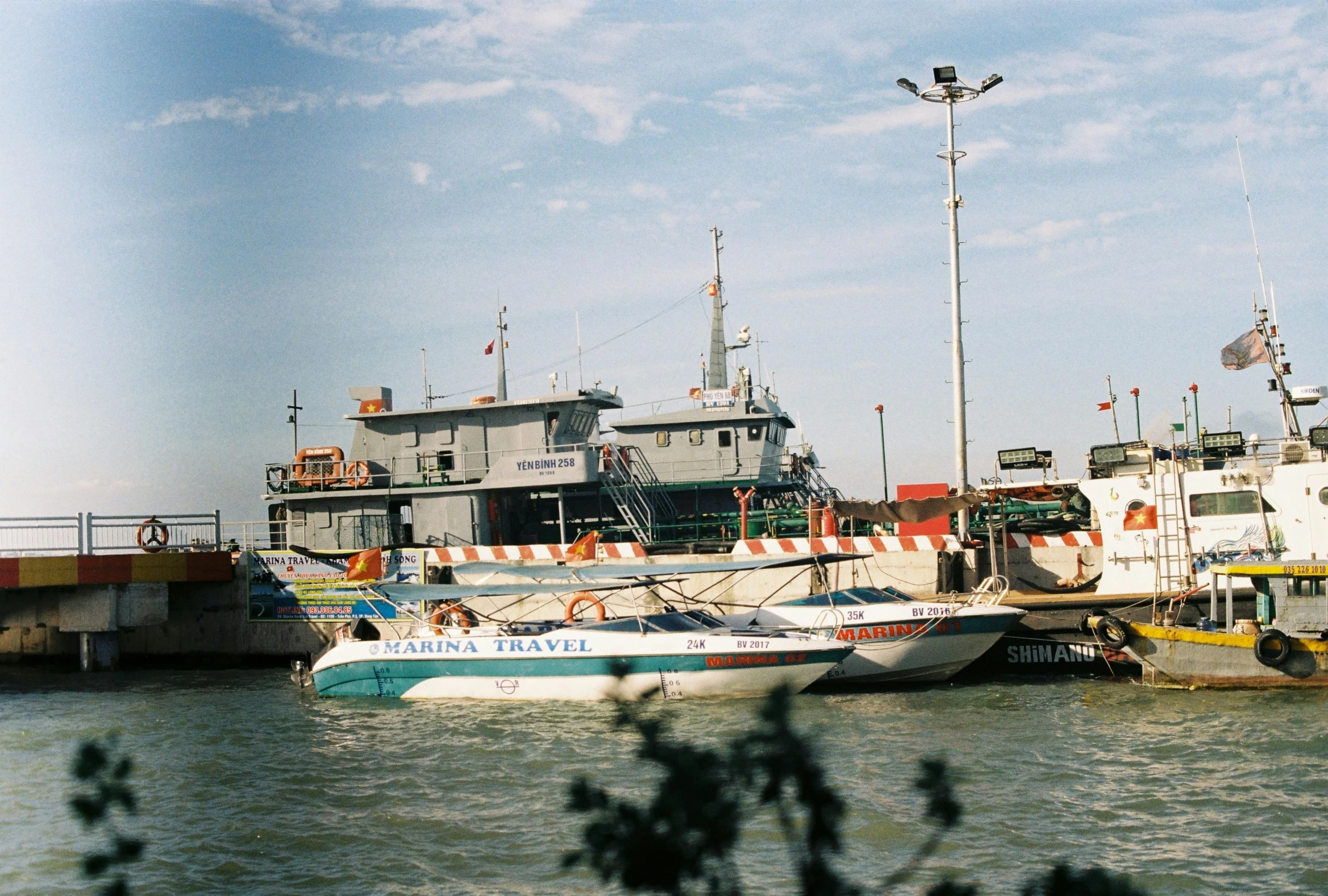 a group of boats that are floating in some water