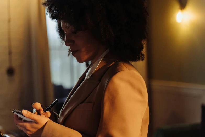 a woman is looking at her cell phone