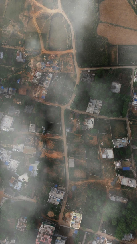 an aerial view of city with large area with houses