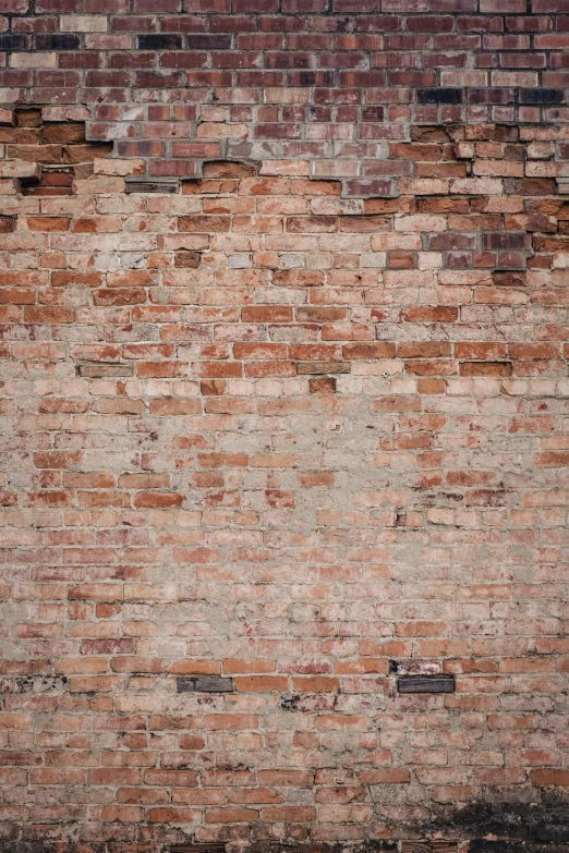 a large brick wall is surrounded by smaller bricks