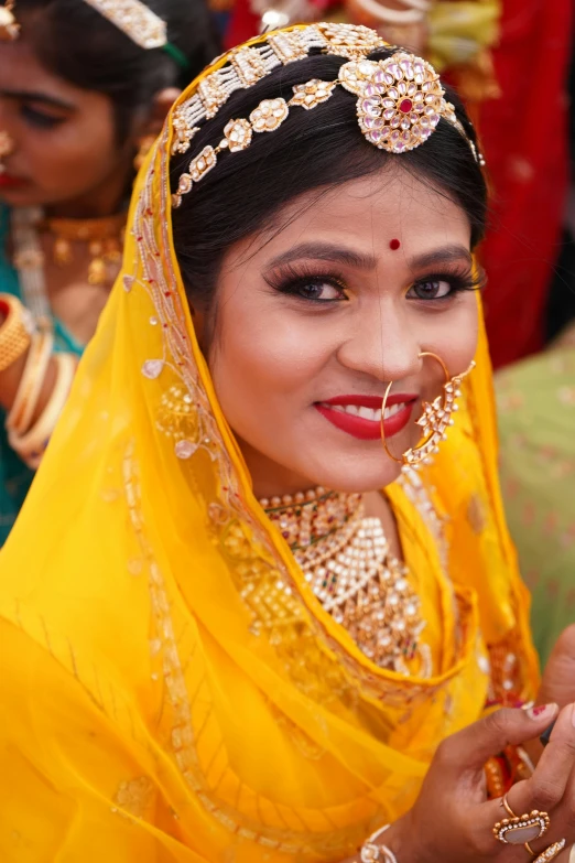 beautiful woman dressed in indian bridal attire smiling