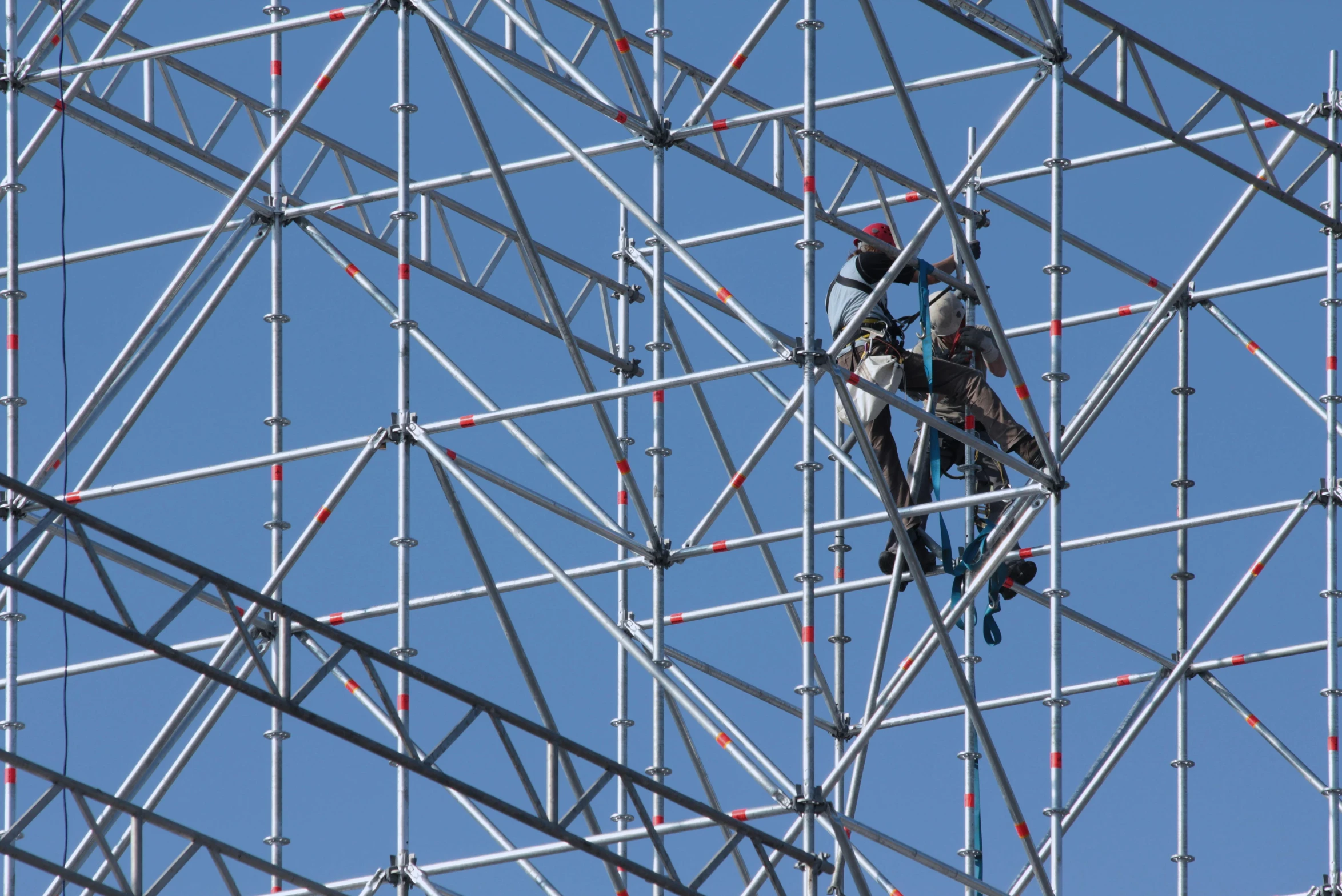 a construction worker is fixing soing on the wires