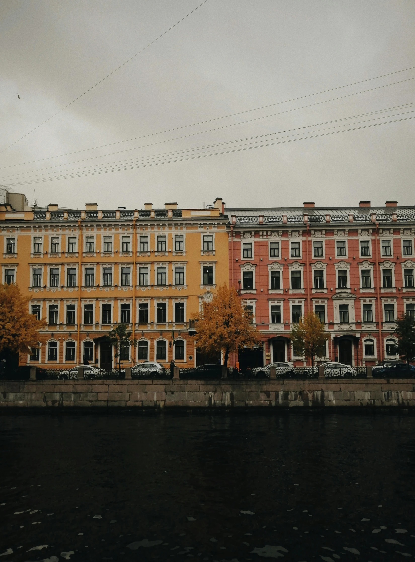 an old looking building beside some water