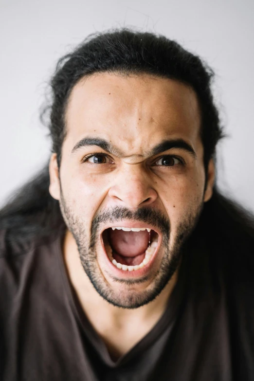 a man is making a surprised face with his mouth open