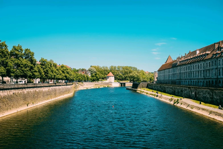 a body of water surrounded by several buildings