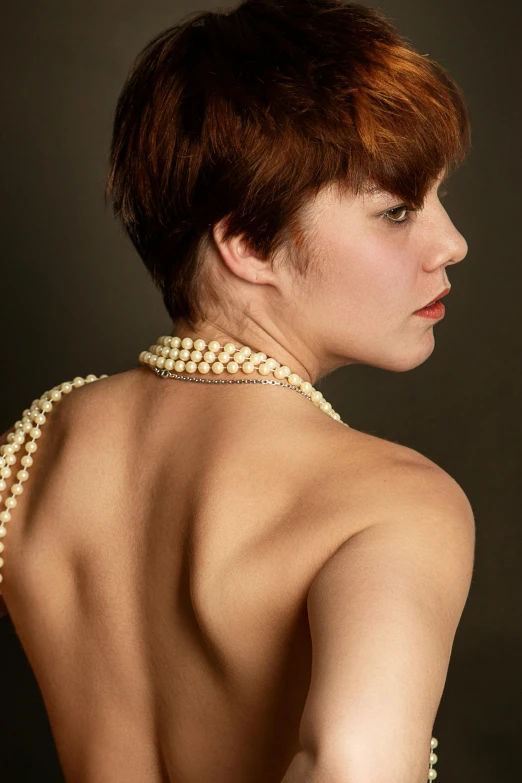 an image of a woman with pearls on her back