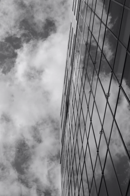 tall buildings next to each other and some clouds in the sky