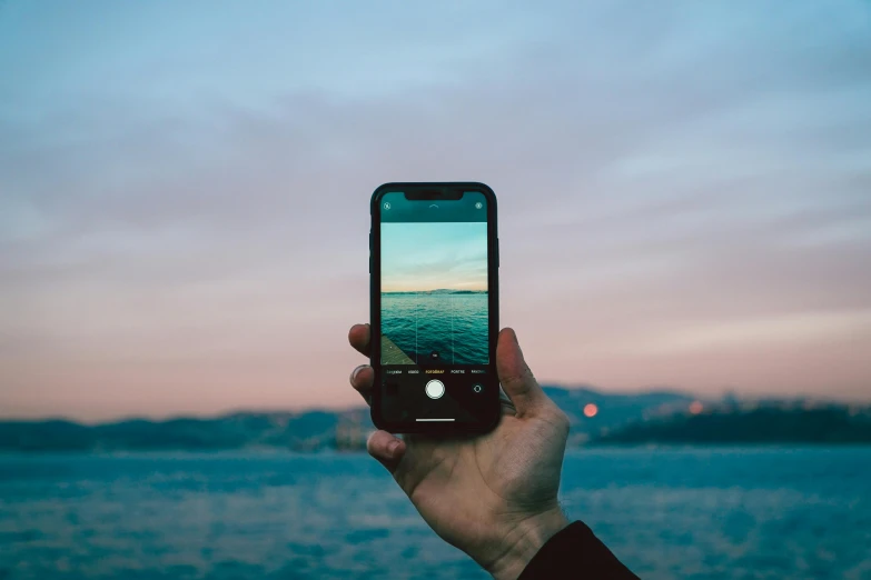 a person is taking a pograph with their phone