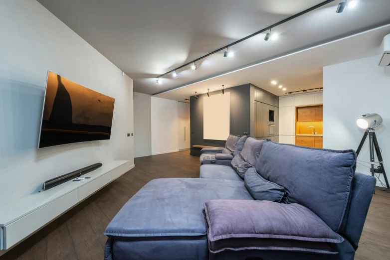 a sofa and foot rest sitting in a living room