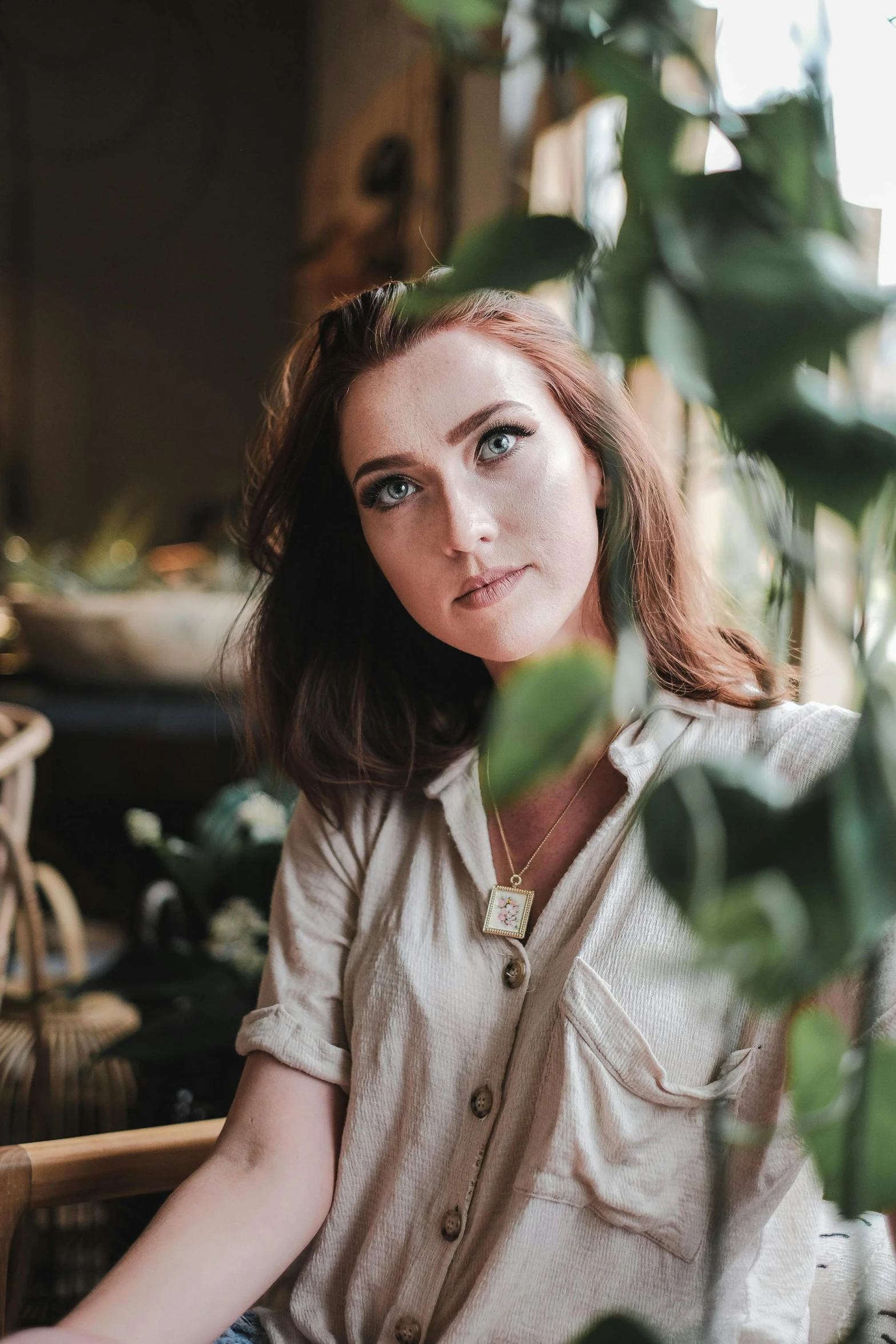 a close up of a person with long hair and blue eyes