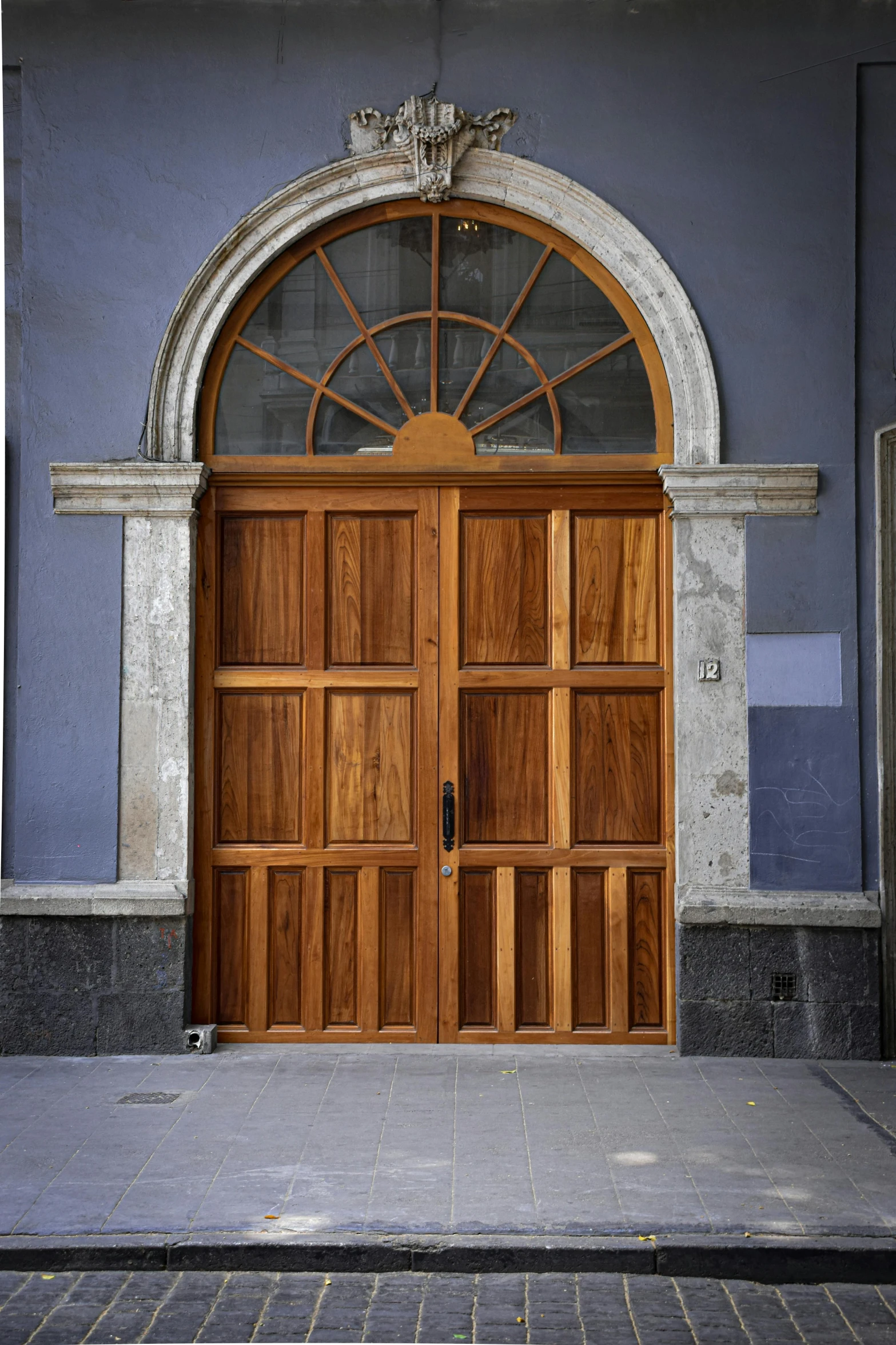 an image of two wood doors on the street