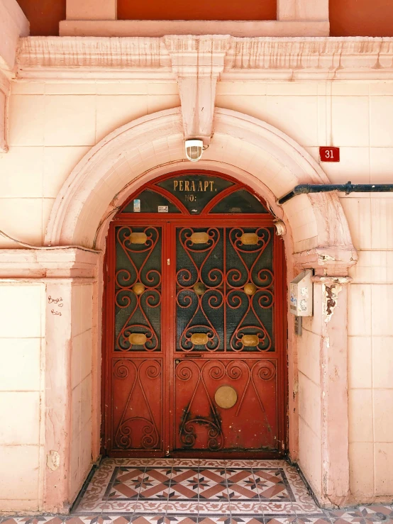 two large doors that are inside of a building