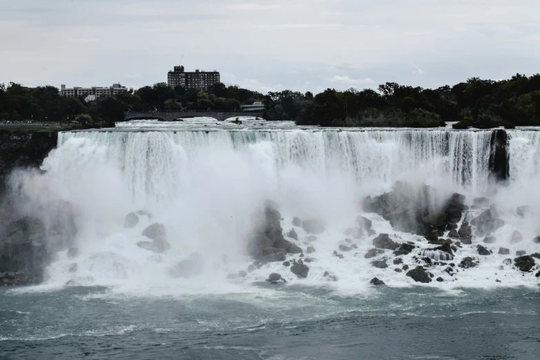 an image of a waterfall with huge water gushing out