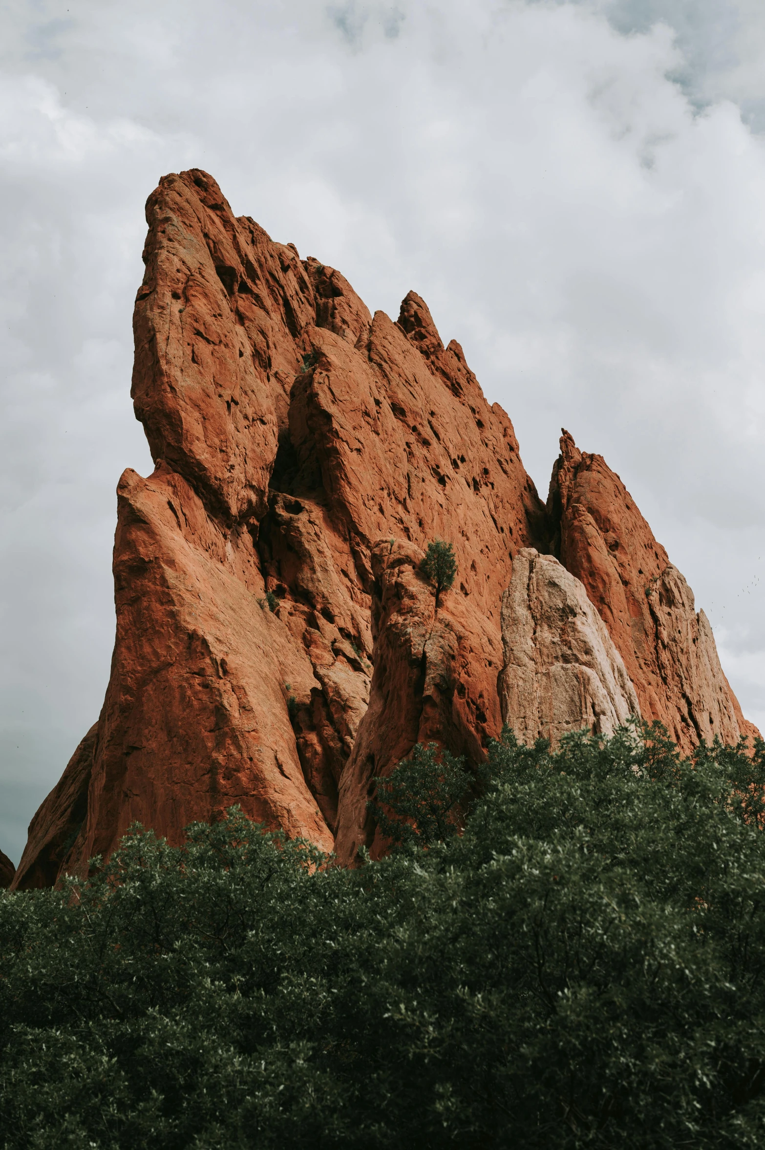 some rocks in the distance with a few clouds