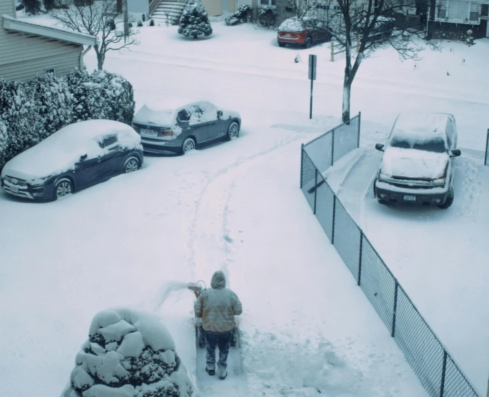 a person standing in the middle of some snow