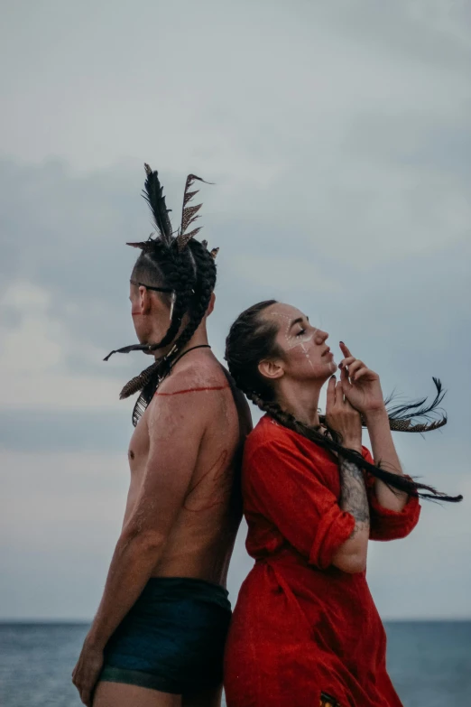 two people standing side by side, looking at the sky