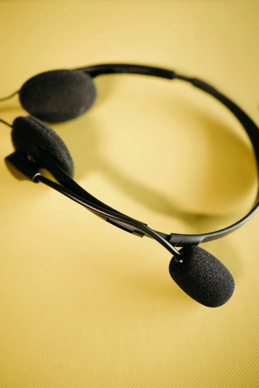 a pair of black headphones with the microphone cord out